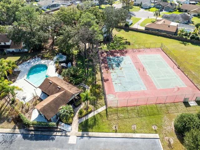 an aerial view of a house with a swimming pool