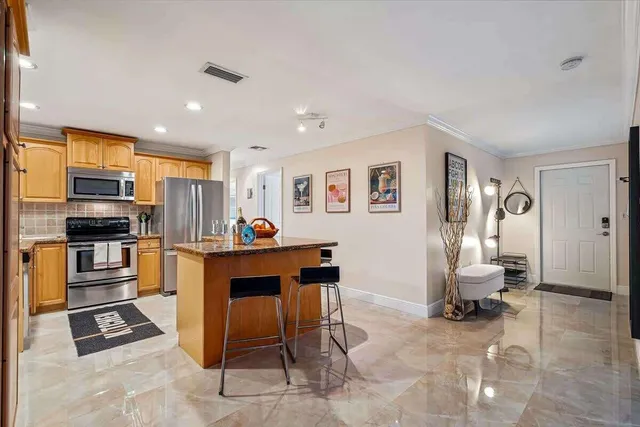 a living room with furniture a dining table and chairs