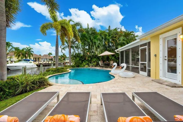 a view of a swimming pool with a patio