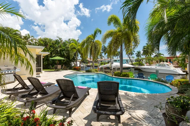a view of outdoor space with swimming pool and lounge chair