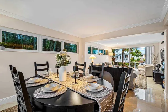 a view of a dining room with furniture window and outside view