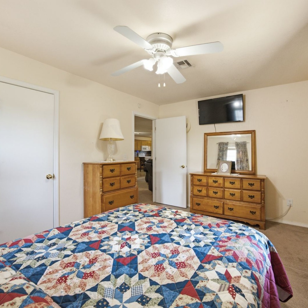 2696 Russellville Road Quinton, OK 74561 - Photo 9 of 40 Room featuring a ceiling fan with integrated lighting, neutral wall paint, and carpet flooring