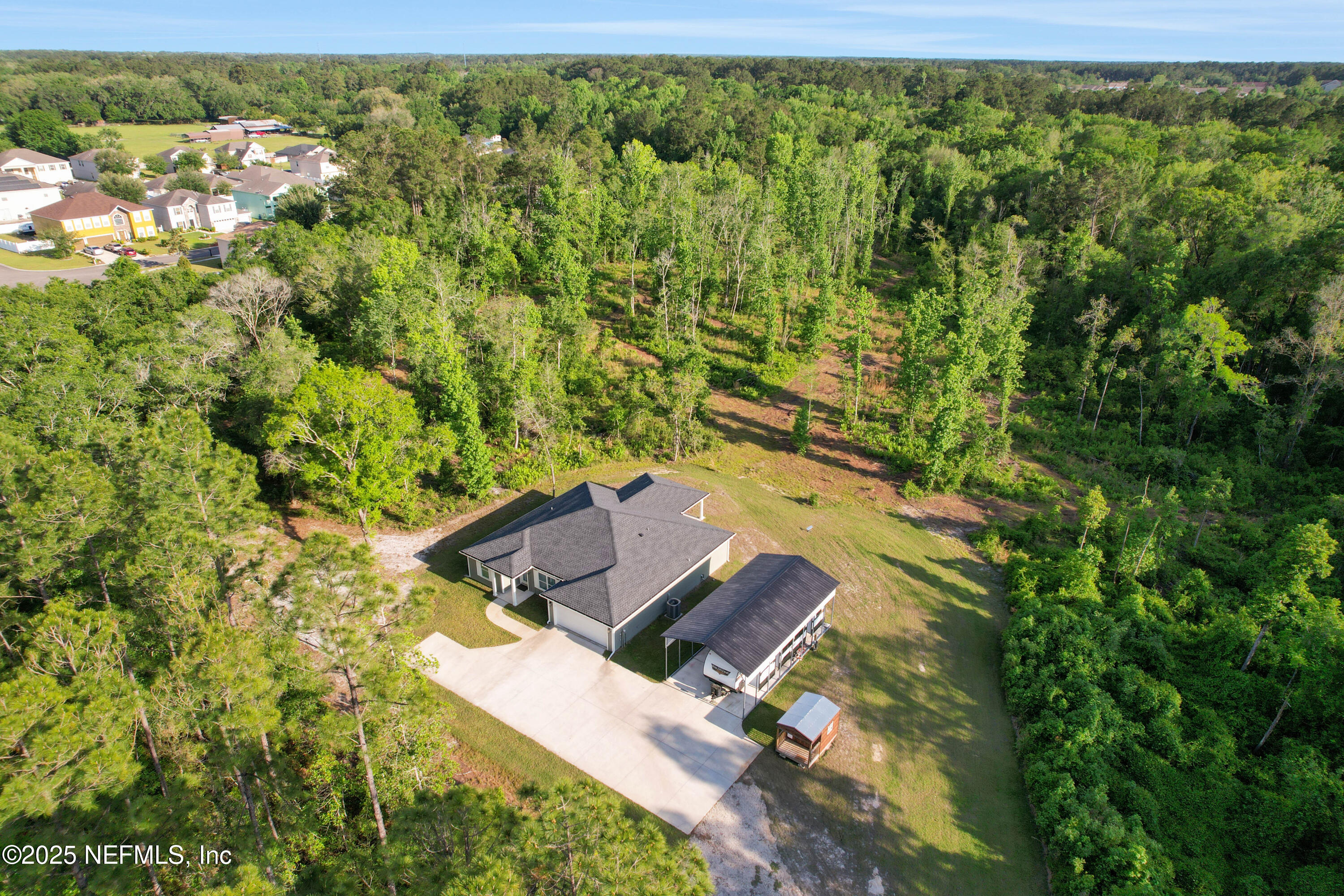 4467 Monroe Smith Road Jacksonville, FL 32210 - Photo 12 of 61 a view of a yard with an outdoor space