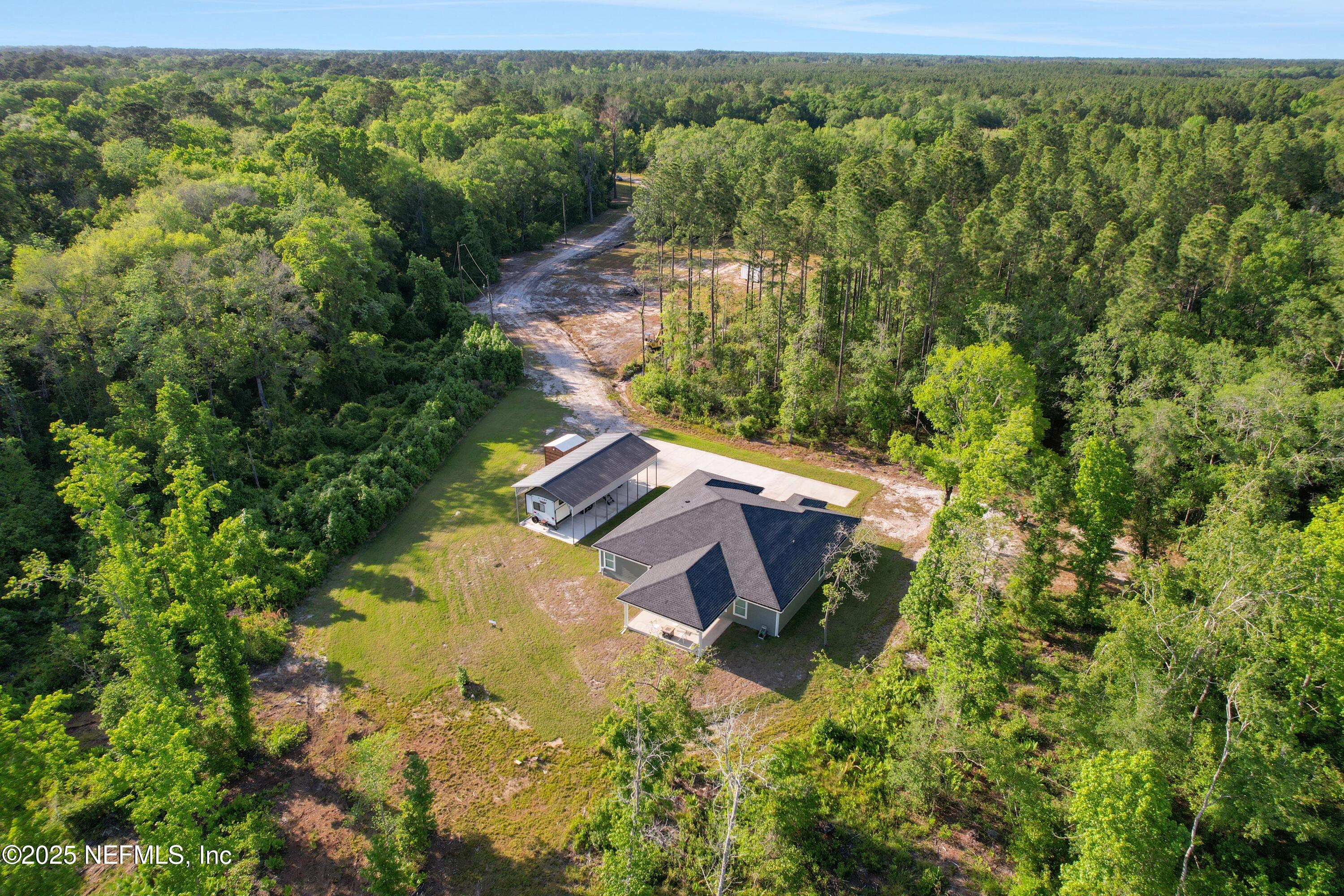 4467 Monroe Smith Road Jacksonville, FL 32210 - Photo 14 of 61 a view of a house with a yard