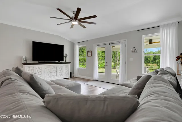a kitchen with white cabinets and appliances