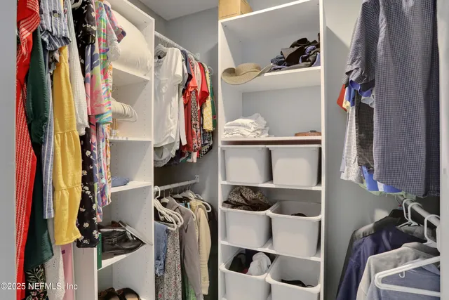 an aerial view of residential house with outdoor space and trees