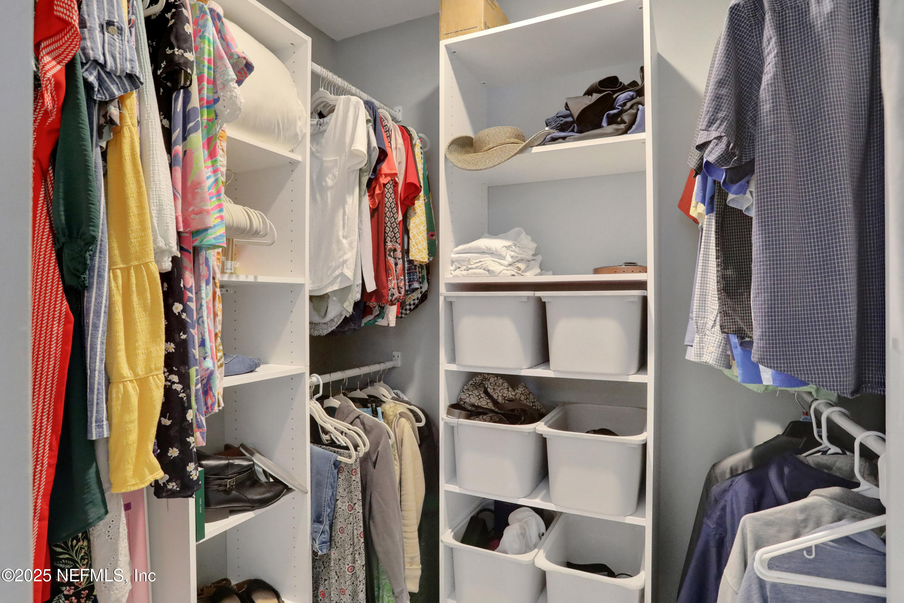 4467 Monroe Smith Road Jacksonville, FL 32210 - Photo 39 of 61 a view of walk in closet with clothes and shoes