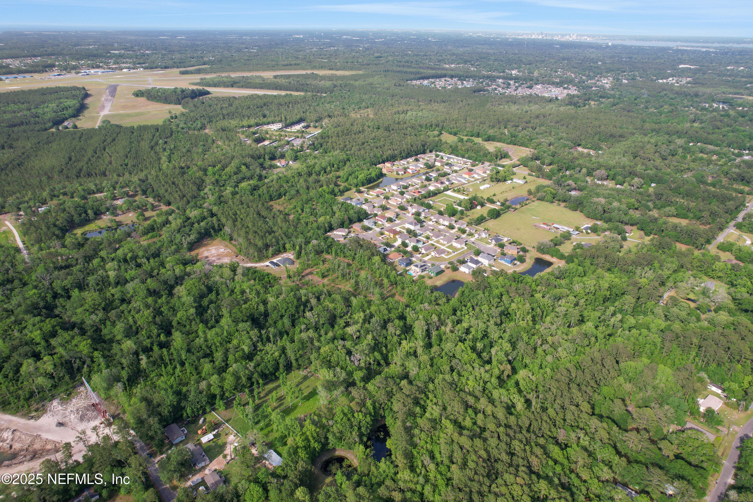 4467 Monroe Smith Road Jacksonville, FL 32210 - Photo 40 of 61 a view of a lake with a city