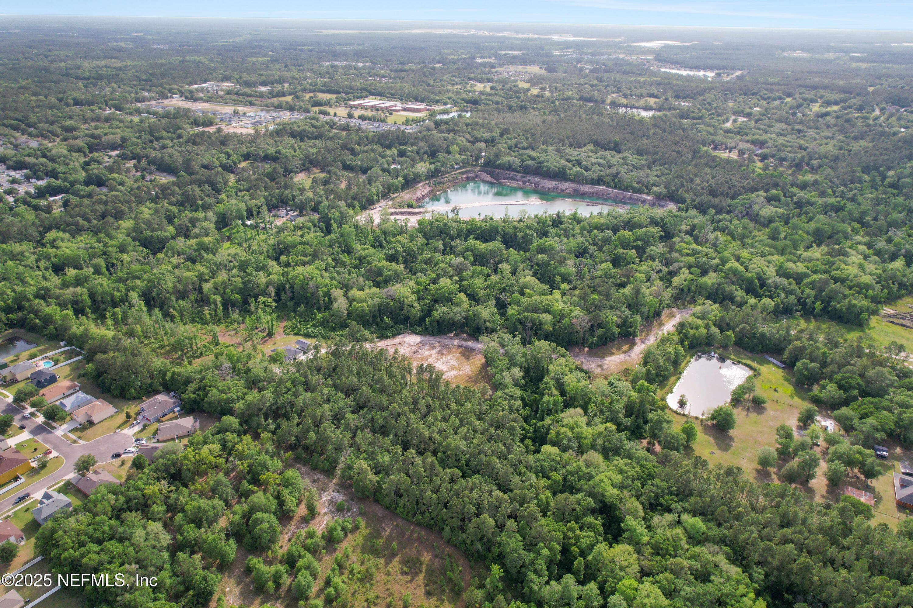 4467 Monroe Smith Road Jacksonville, FL 32210 - Photo 44 of 61 an aerial view of residential house with outdoor space and trees
