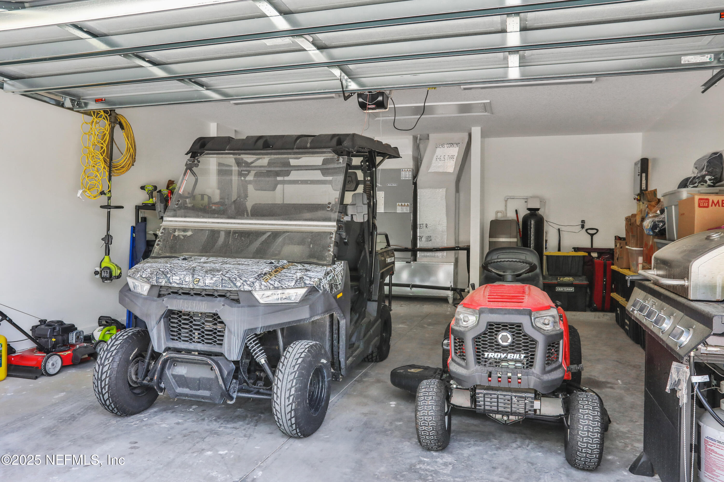 4467 Monroe Smith Road Jacksonville, FL 32210 - Photo 57 of 61 a utility room with lots of furniture and clutter