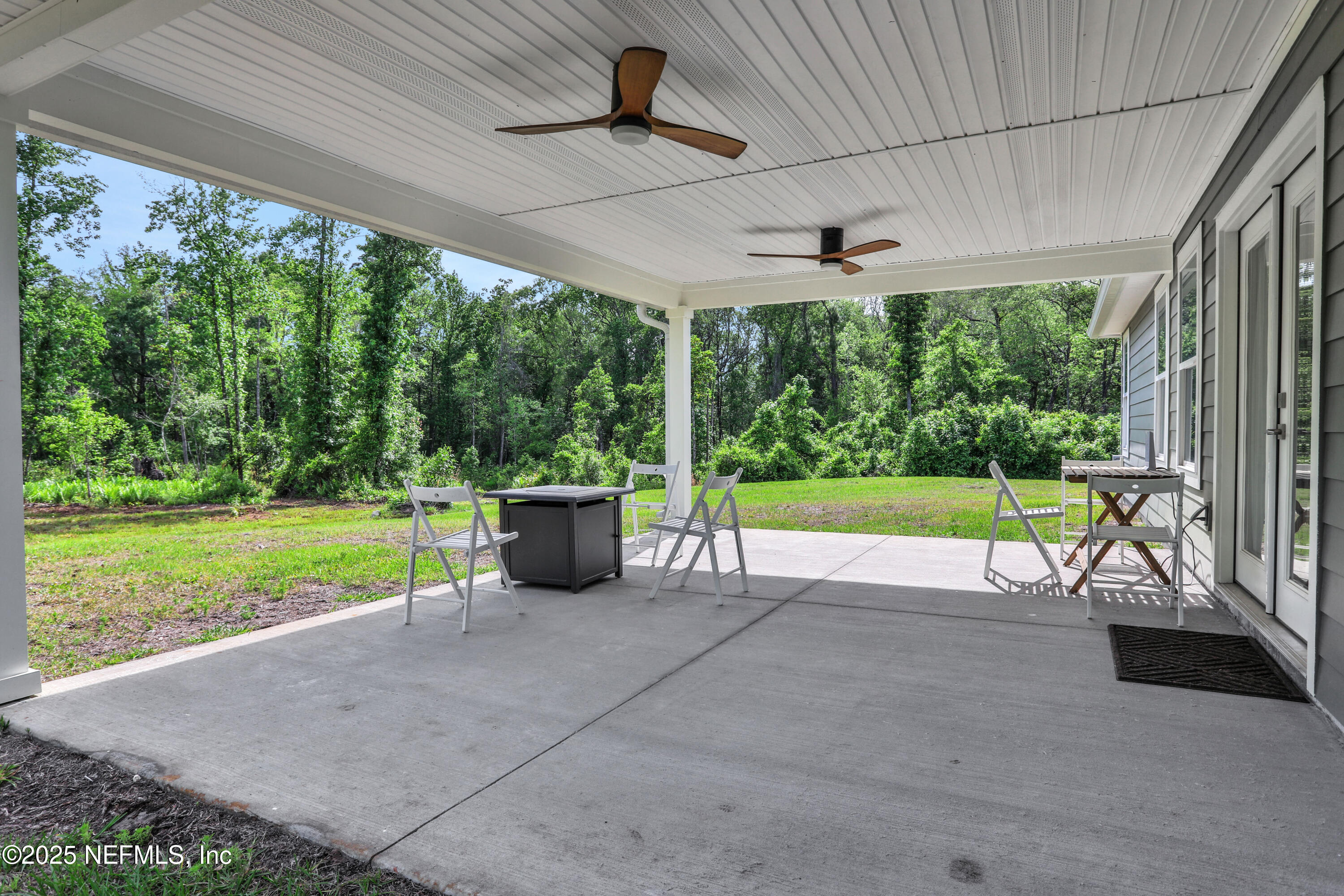 4467 Monroe Smith Road Jacksonville, FL 32210 - Photo 58 of 61 a view of a porch with furniture and garden