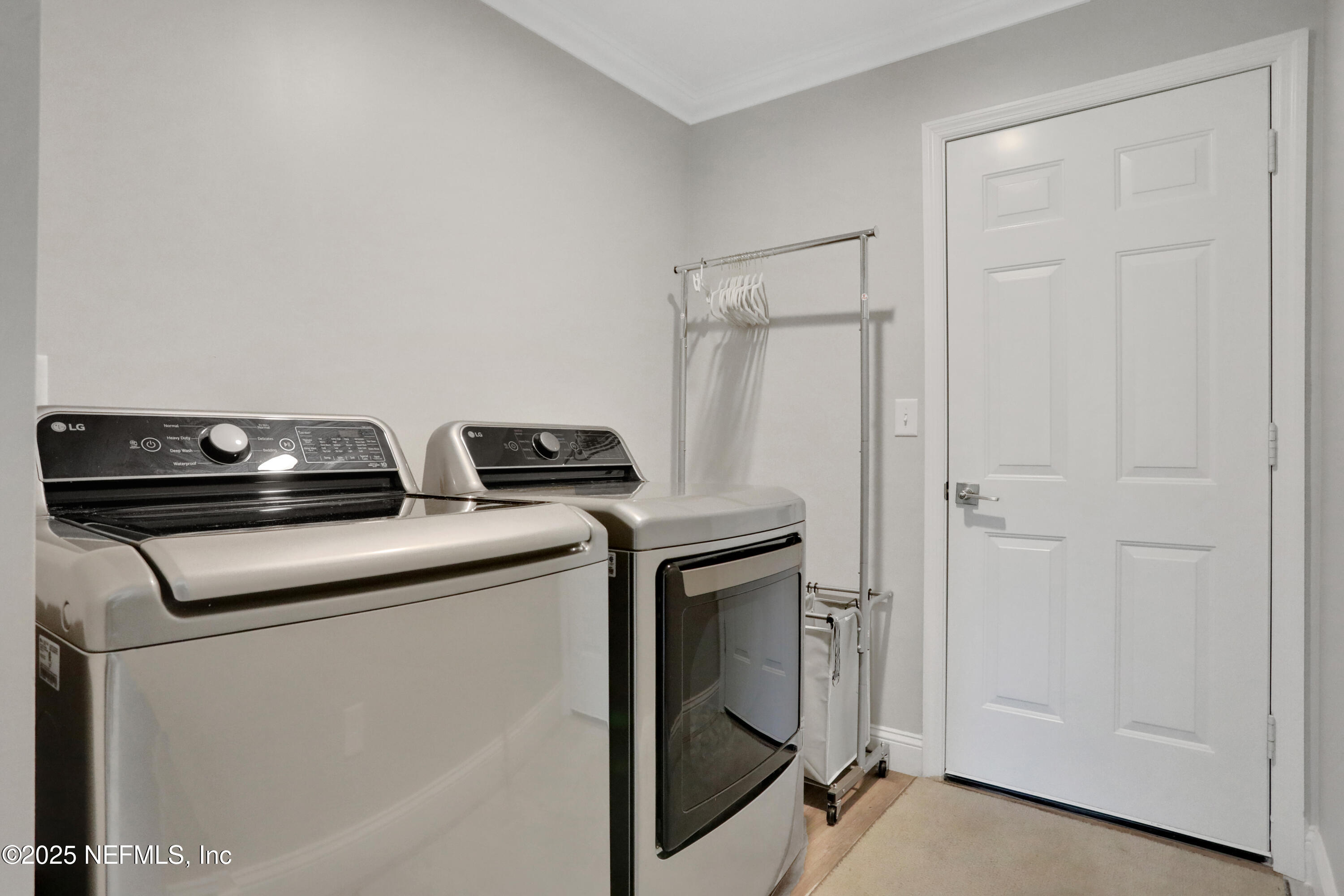 4467 Monroe Smith Road Jacksonville, FL 32210 - Photo 60 of 61 a utility room with dryer and washer