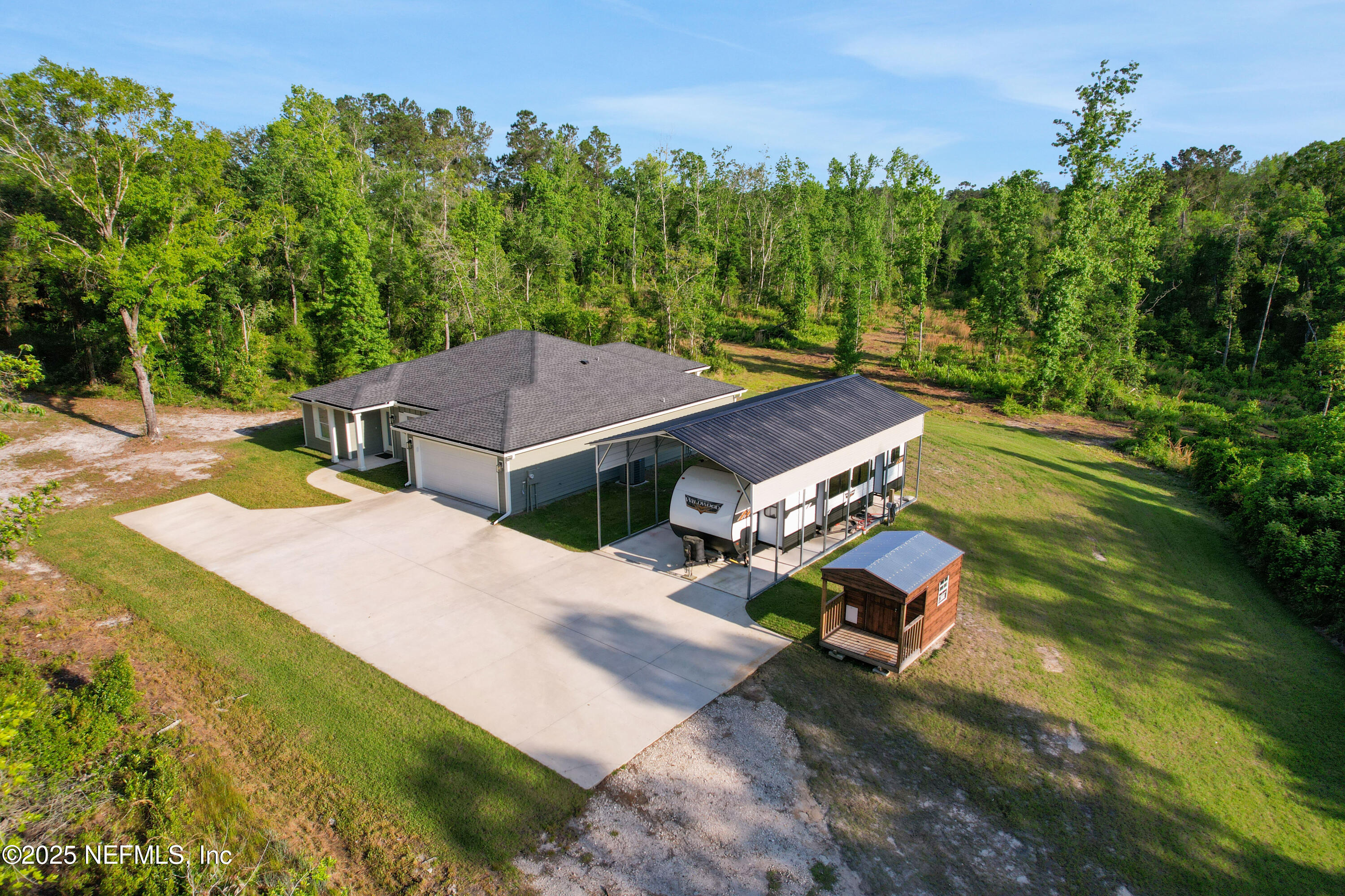 4467 Monroe Smith Road Jacksonville, FL 32210 - Photo 6 of 61 an aerial view of a house with a yard