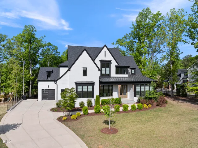 a front view of a house with yard