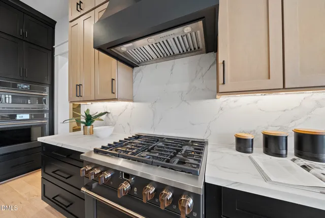 a view of a dining room with furniture a chandelier and wooden floor