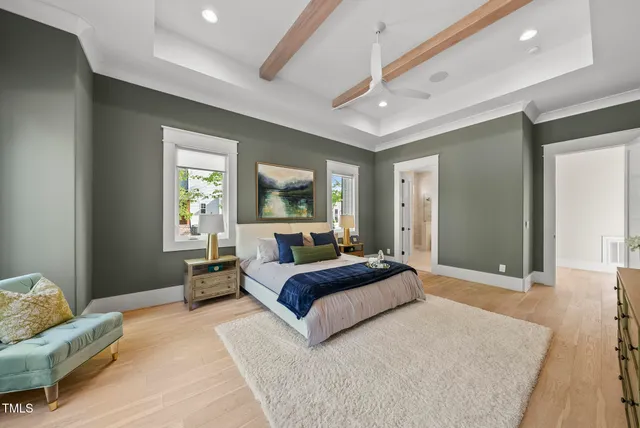a bathroom with a tub a sink and mirror