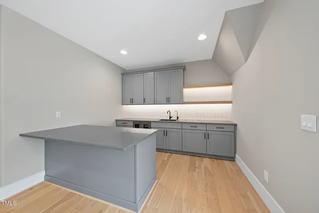 a bathroom with a shower and mirror