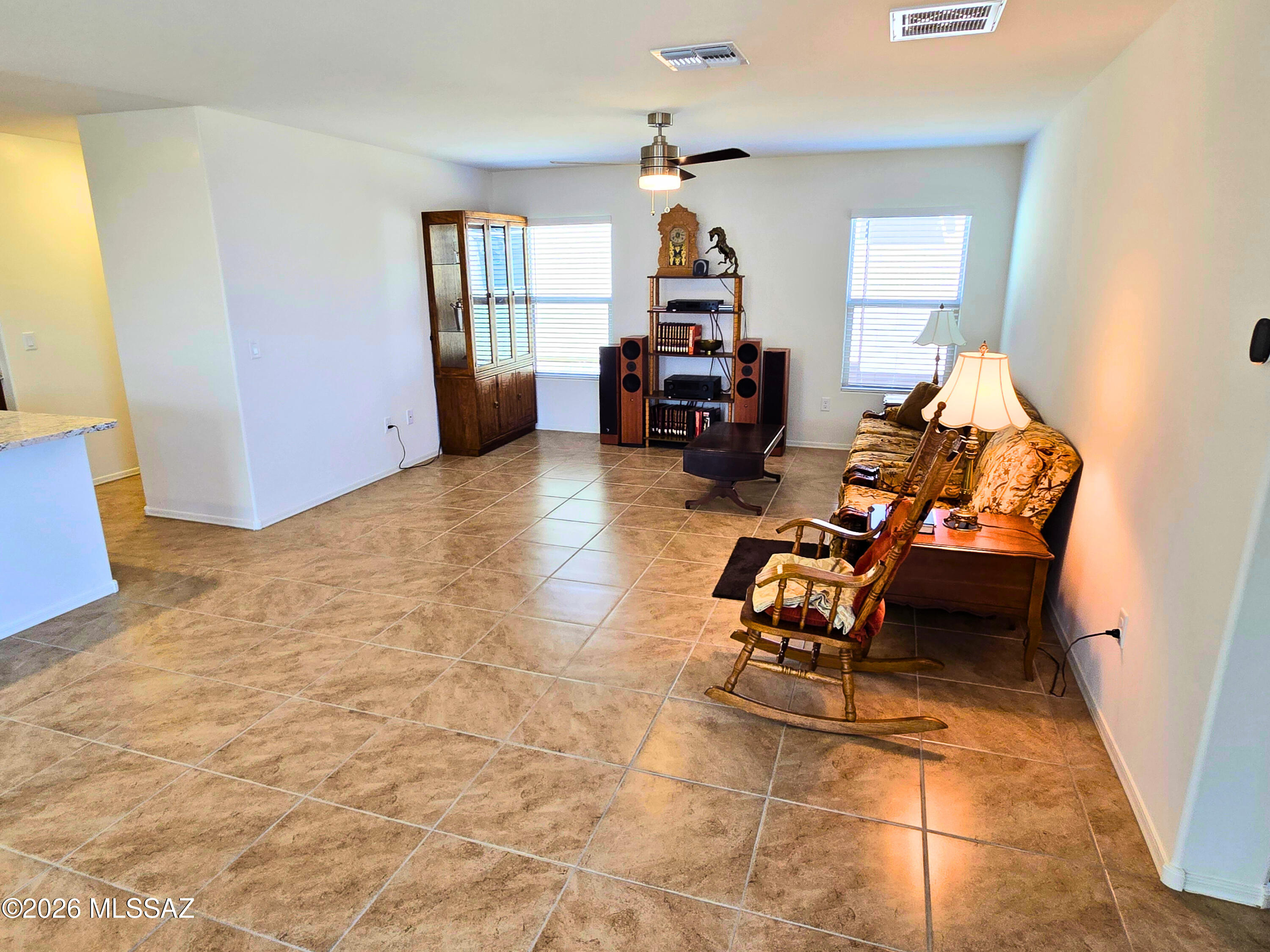 6343 South Rigby Way Tucson, AZ 85746 - Photo 12 of 29 a room with furniture and a window
