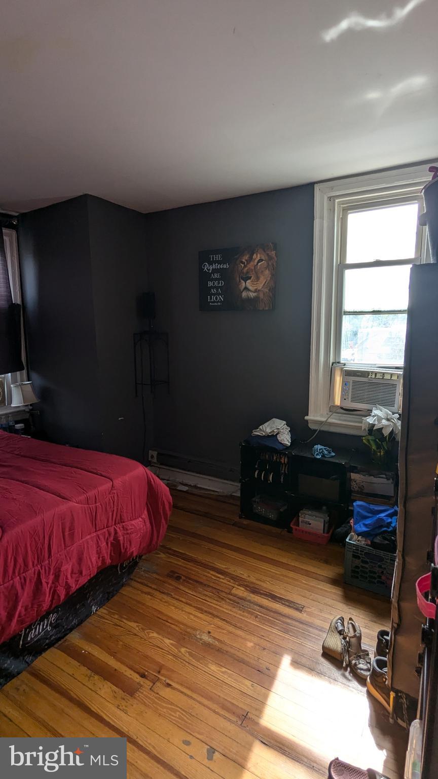 1850 South 54th Street Philadelphia, PA 19143 - Photo 12 of 13 a bedroom with a bed and a closet