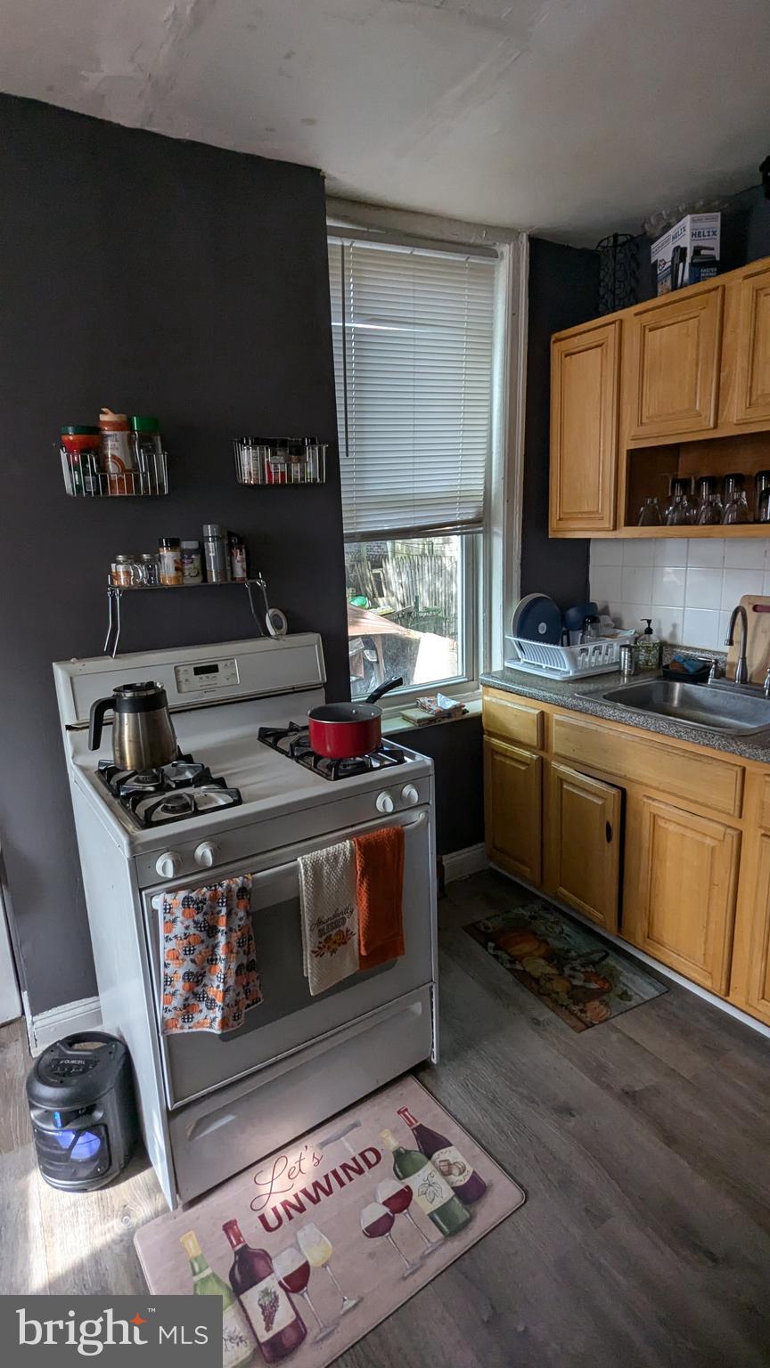 1850 South 54th Street Philadelphia, PA 19143 - Photo 4 of 13 a kitchen with a stove and a sink