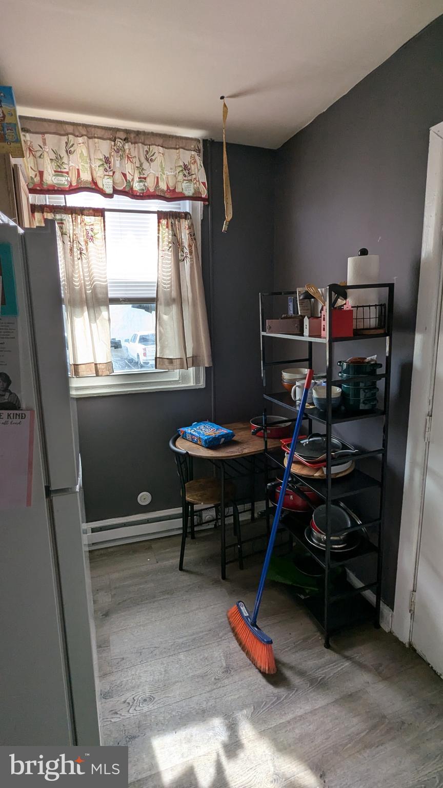 1850 South 54th Street Philadelphia, PA 19143 - Photo 6 of 13 a view of a workspace with furniture and a window