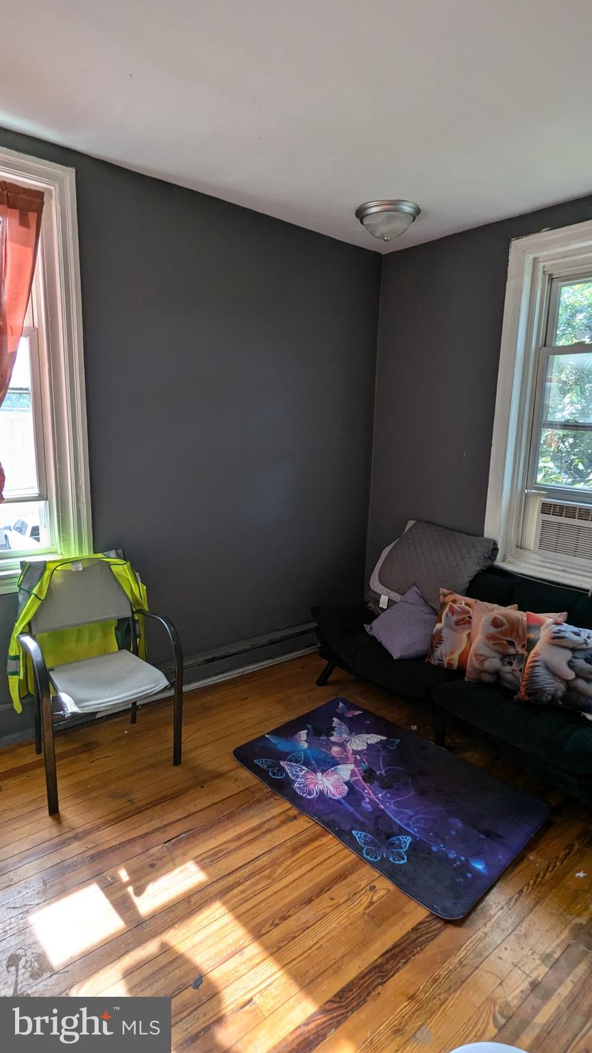 1850 South 54th Street Philadelphia, PA 19143 - Photo 9 of 13 a bedroom with a bed and a window
