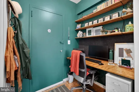 a view of work space with cabinets