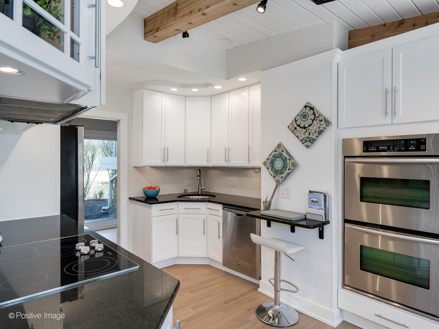 1906 Berkeley Road Highland Park, IL 60035 - Photo 11 of 28 a kitchen with granite countertop a stove and a refrigerator