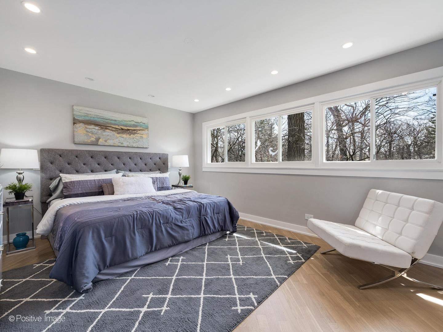 1906 Berkeley Road Highland Park, IL 60035 - Photo 15 of 28 a spacious bedroom with a bed and wooden floor