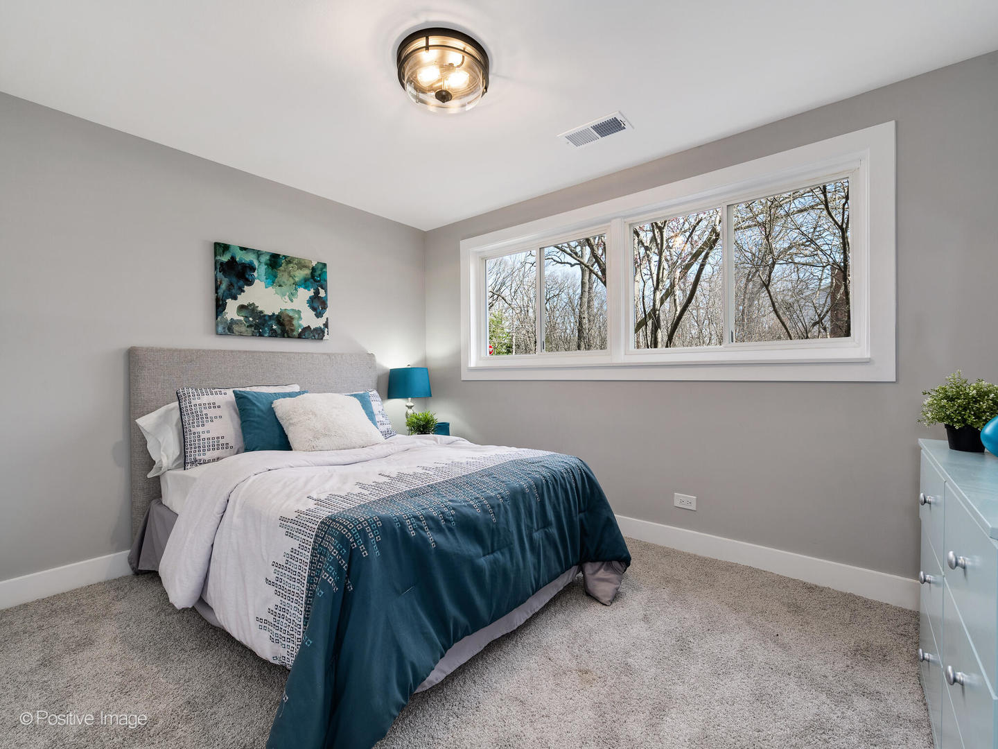 1906 Berkeley Road Highland Park, IL 60035 - Photo 19 of 28 a bedroom with a bed and a painting on the wall