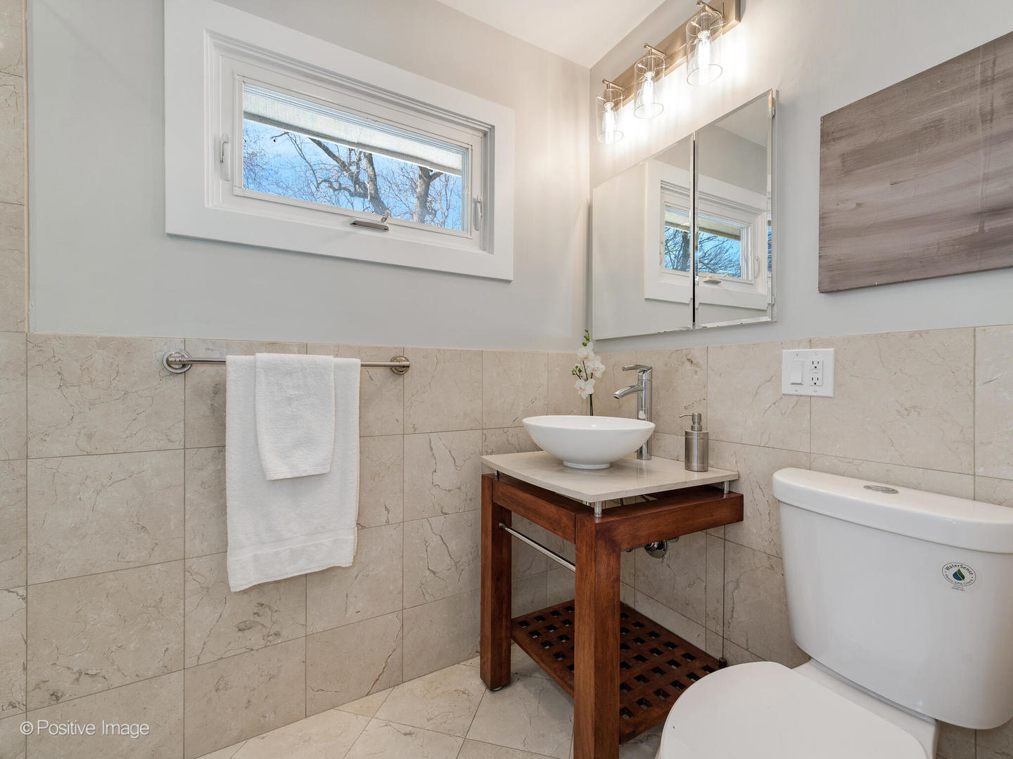 1906 Berkeley Road Highland Park, IL 60035 - Photo 22 of 28 a bathroom with a sink toilet and a mirror