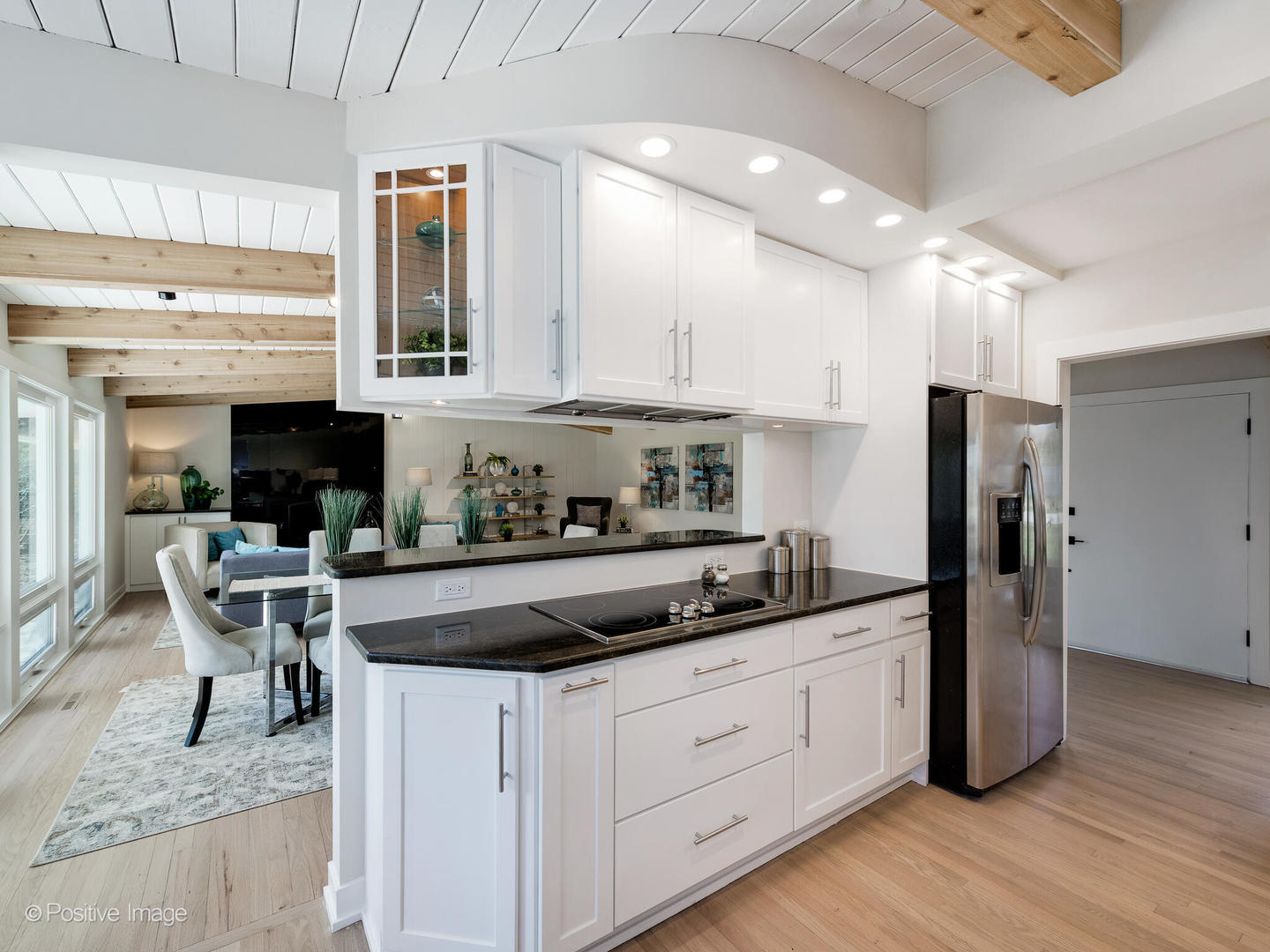 1906 Berkeley Road Highland Park, IL 60035 - Photo 9 of 28 a kitchen with stainless steel appliances granite countertop a refrigerator a sink dishwasher a stove and white cabinets with wooden floor