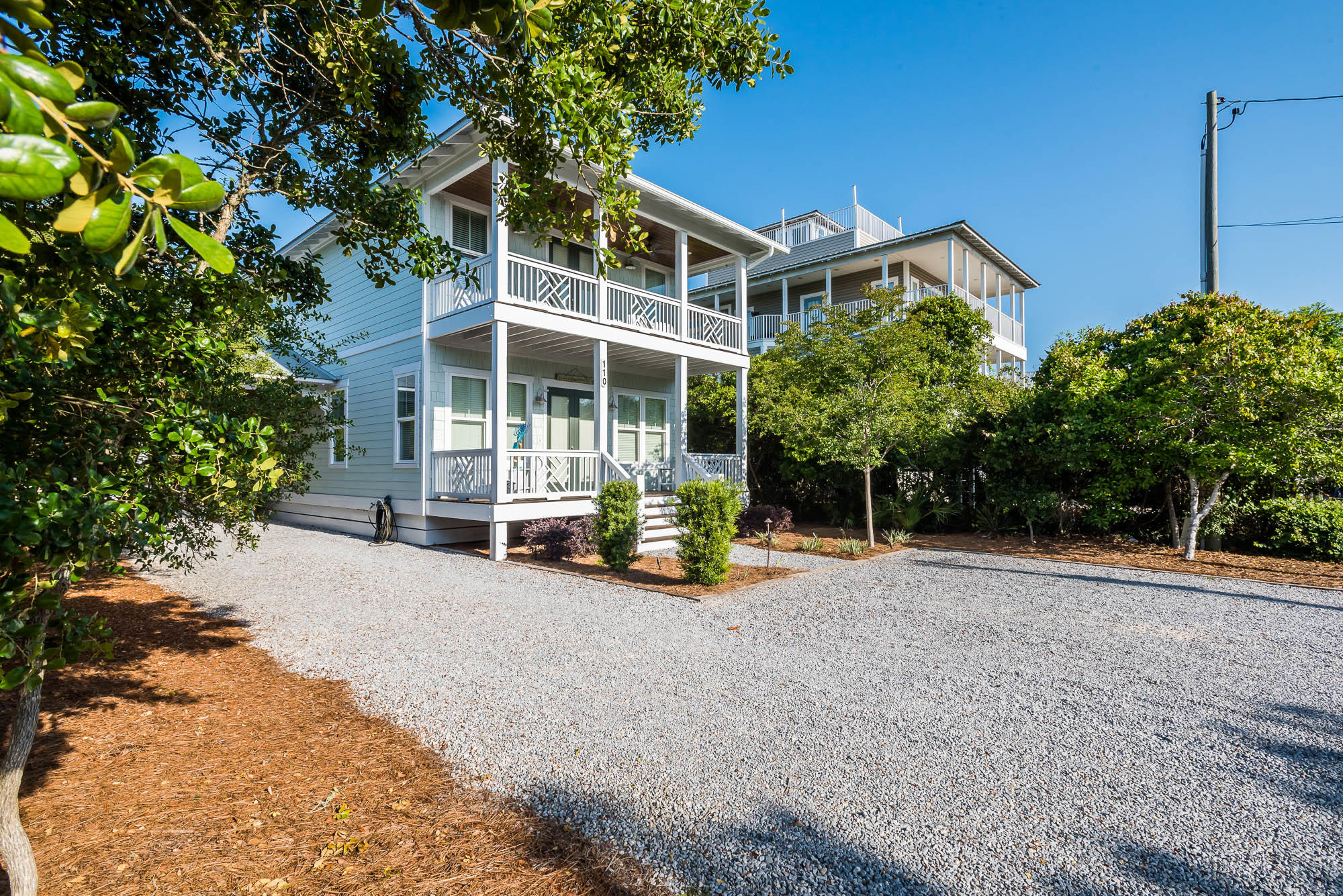 110 Gulf Point Road Santa Rosa Beach, FL 32459 - Photo 2 of 39 a view of a house with backyard and sitting area