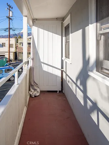 a view of a kitchen with a sink and cabinets