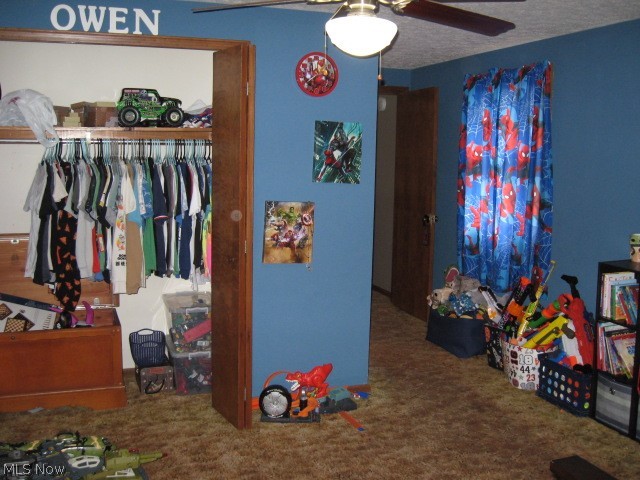 1166 Bass Circle Northwest Canton, OH 44708 - Photo 15 of 25 Bedroom featuring carpet, ceiling fan, and a closet