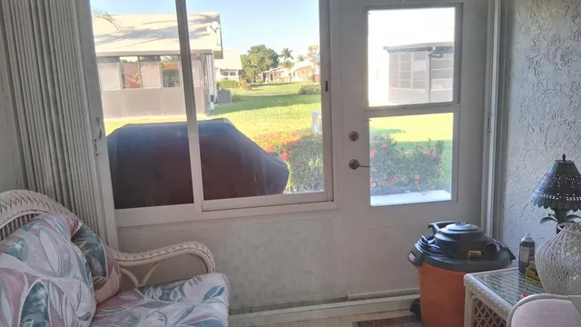 a view of a swimming pool with outdoor seating and city view