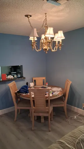 a view of a room with a window and brick walls