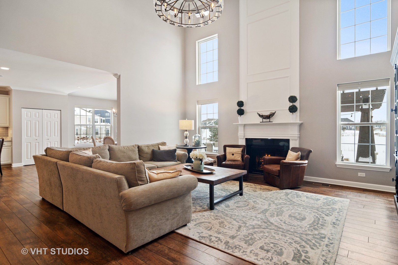 3577 Harold Circle Hoffman Estates, IL 60192 - Photo 11 of 32 a living room with furniture a fireplace and a table