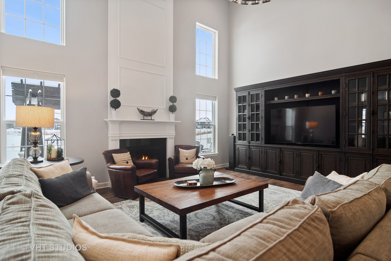 3577 Harold Circle Hoffman Estates, IL 60192 - Photo 12 of 32 a living room with furniture a flat screen tv and a fireplace