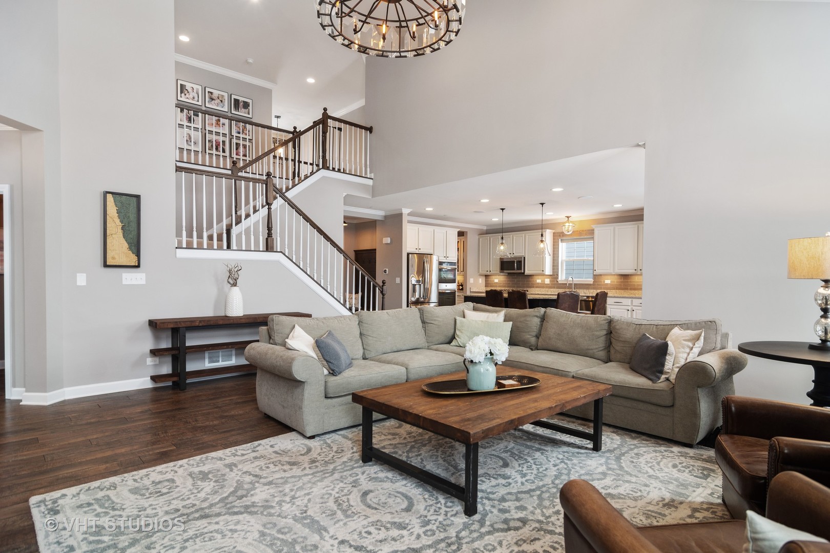 3577 Harold Circle Hoffman Estates, IL 60192 - Photo 13 of 32 a living room with furniture dining table a rug and a chandelier