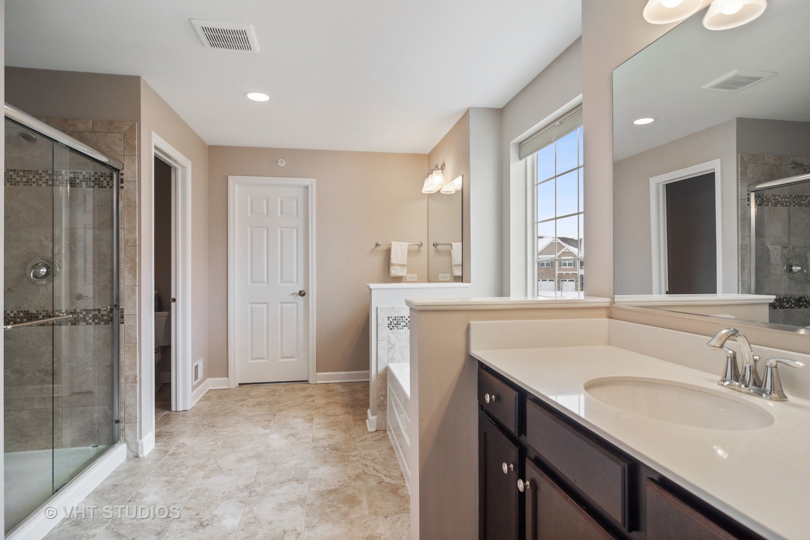 3577 Harold Circle Hoffman Estates, IL 60192 - Photo 19 of 32 a bathroom with a sink double vanity and a shower