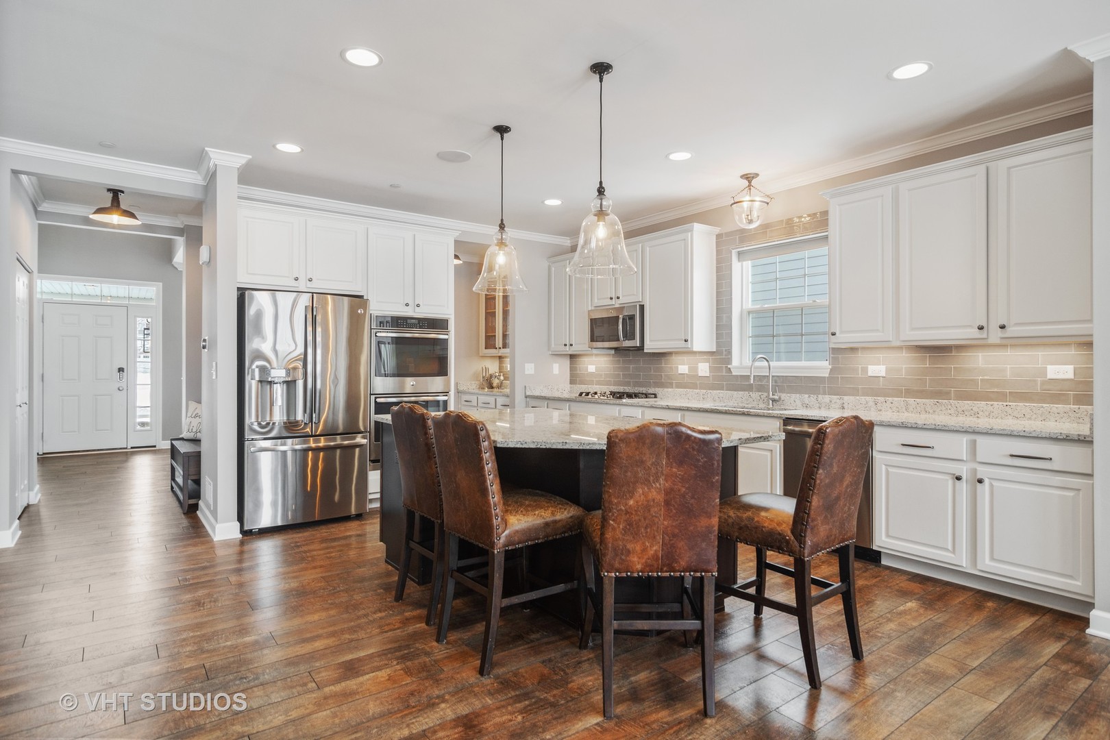 3577 Harold Circle Hoffman Estates, IL 60192 - Photo 4 of 32 a kitchen with stainless steel appliances granite countertop a kitchen island hardwood floor and a refrigerator