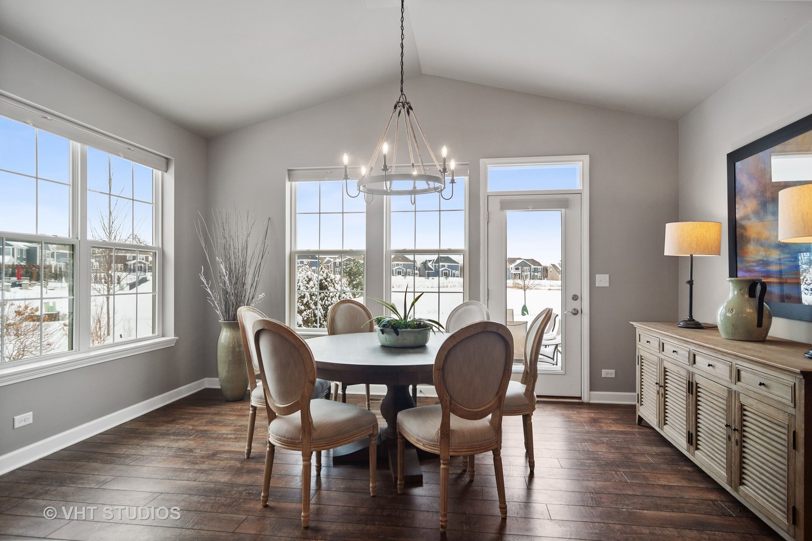 3577 Harold Circle Hoffman Estates, IL 60192 - Photo 8 of 32 a dining room with furniture a chandelier and wooden floor
