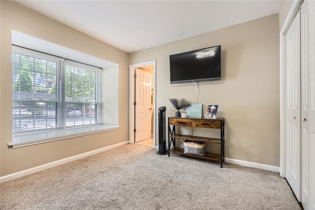 81 La Rue Place Northwest Atlanta, GA 30327 - Photo 16 of 24 a room with furniture and flat screen tv