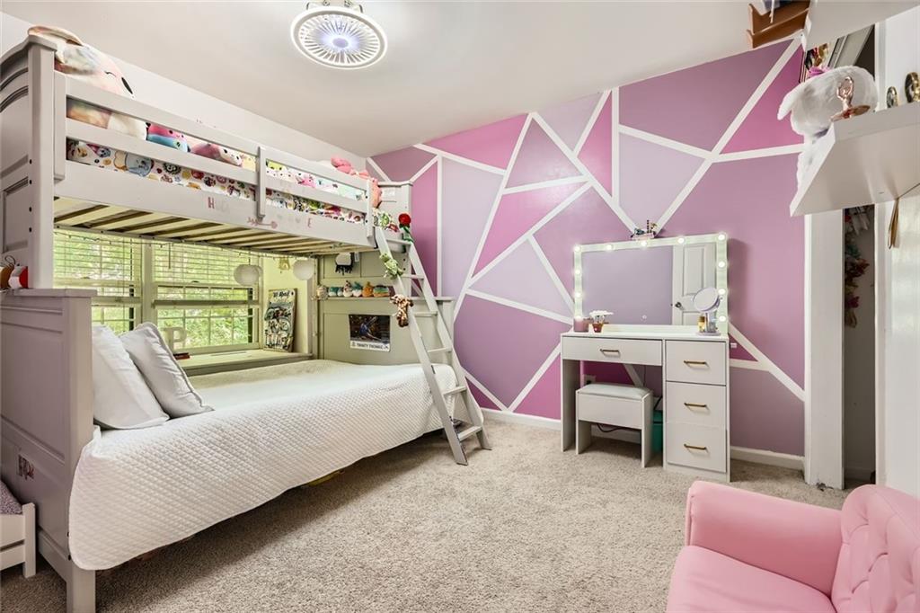 81 La Rue Place Northwest Atlanta, GA 30327 - Photo 19 of 24 a bedroom with a bed and a couch