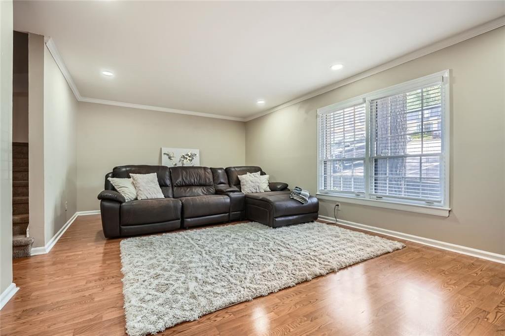 81 La Rue Place Northwest Atlanta, GA 30327 - Photo 5 of 24 a living room with furniture and a window