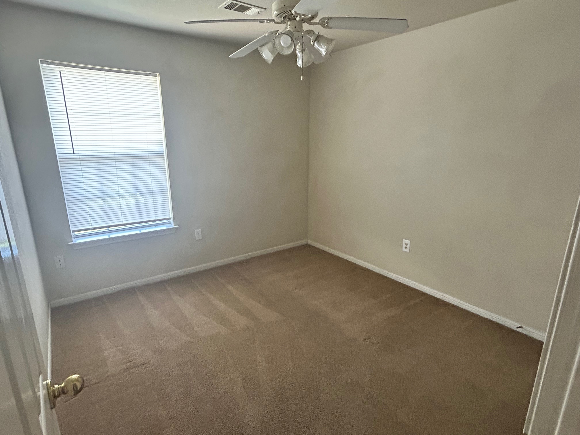 3104 Yaupon Road Copperas Cove, TX 76522 - Photo 3 of 9 Unfurnished room with dark colored carpet and a ceiling fan