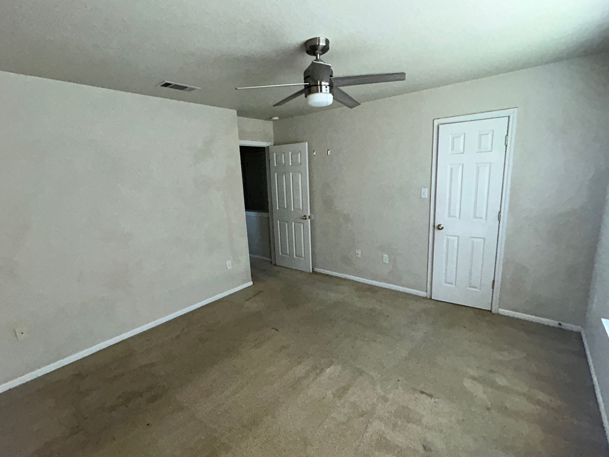 3104 Yaupon Road Copperas Cove, TX 76522 - Photo 5 of 9 Unfurnished bedroom featuring ceiling fan and carpet