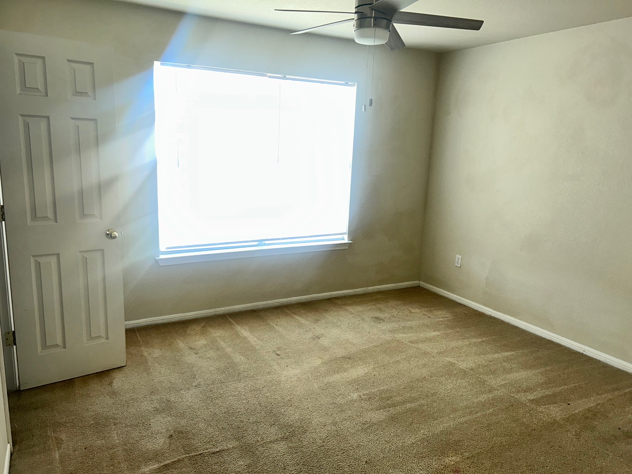 3104 Yaupon Road Copperas Cove, TX 76522 - Photo 6 of 9 Empty room with healthy amount of natural light, light colored carpet, and a ceiling fan