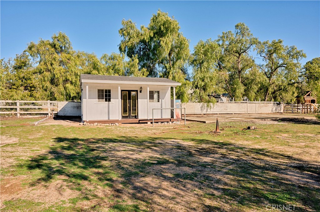 33342 Trail Ranch Road Agua Dulce, CA 91390 - Photo 13 of 40 a view of a house with a swimming pool